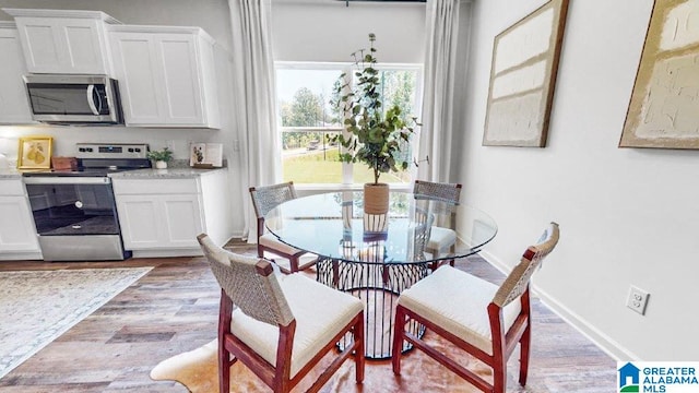 dining room with light hardwood / wood-style floors