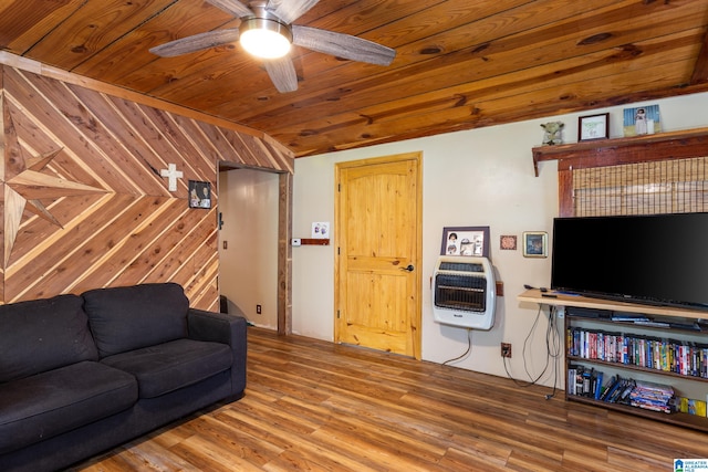 living room with wood-type flooring, wooden ceiling, wood walls, and ceiling fan