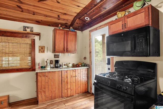 kitchen with beamed ceiling, wood ceiling, range with gas stovetop, and light wood-type flooring