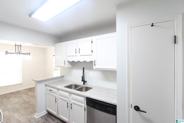 kitchen with white cabinets, hardwood / wood-style floors, sink, and dishwasher