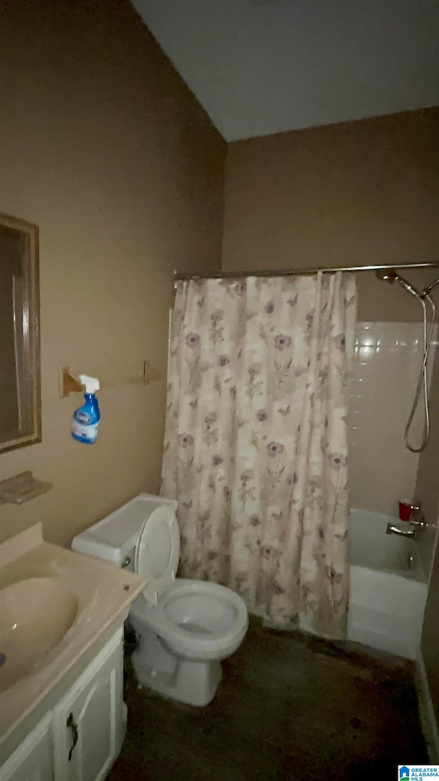 full bathroom featuring toilet, vanity, and shower / tub combo with curtain