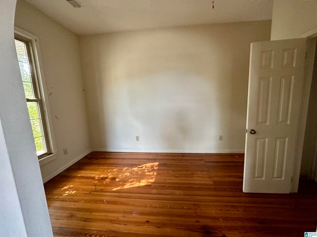 empty room featuring hardwood / wood-style flooring