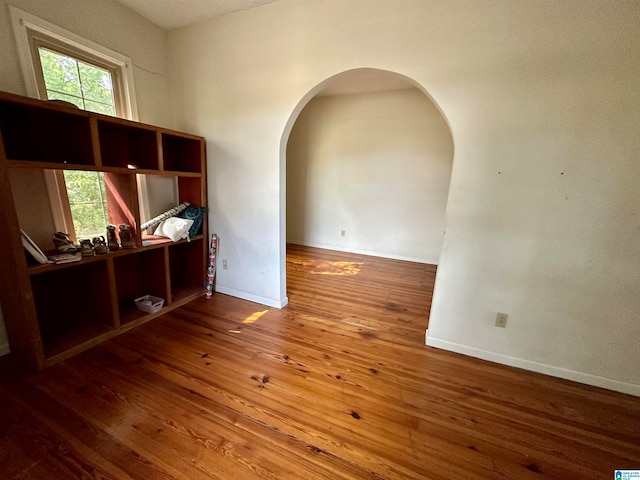 unfurnished room featuring hardwood / wood-style floors