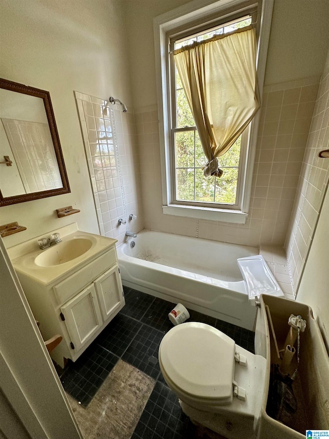 bathroom featuring a bathing tub, toilet, tile flooring, and large vanity