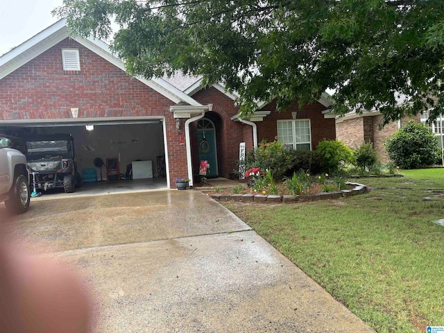 view of front of home featuring a front lawn and a garage