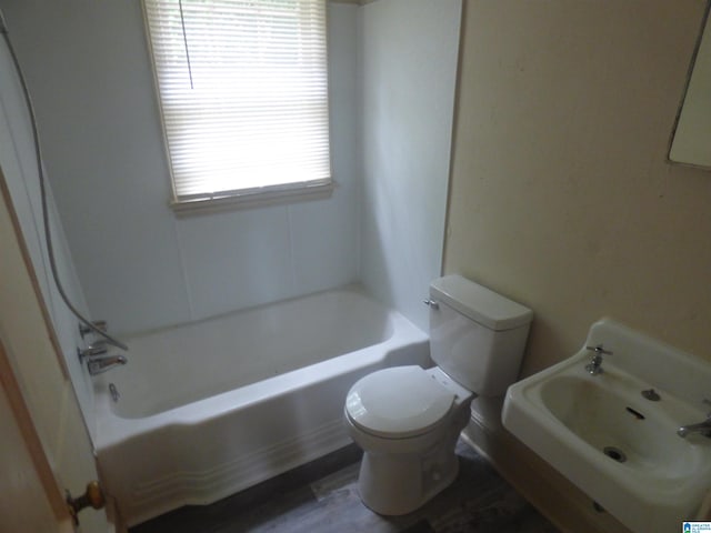 full bathroom featuring shower / bathtub combination, sink, and toilet