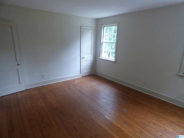 unfurnished room featuring wood-type flooring