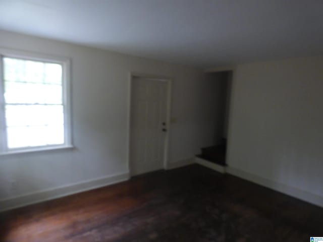 unfurnished room featuring hardwood / wood-style floors