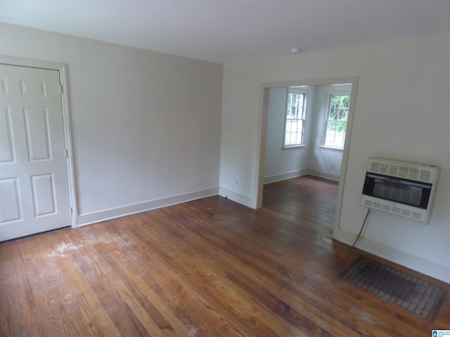 unfurnished room featuring dark wood-type flooring
