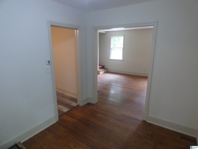 hall with dark hardwood / wood-style floors