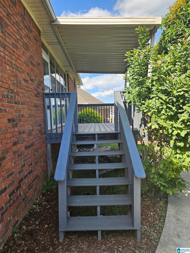 exterior space featuring brick wall