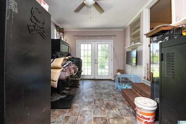 doorway with stone finish floor, french doors, crown molding, and ceiling fan