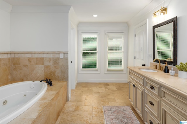 bathroom featuring tiled bath, vanity, and tile floors