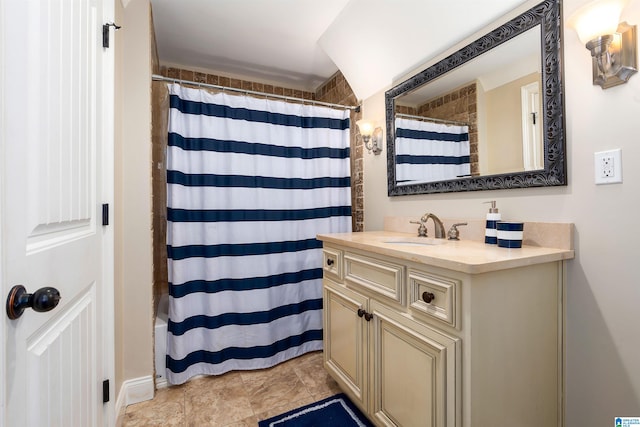 bathroom featuring tile flooring and large vanity