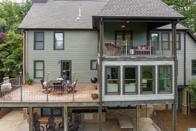 back of property with a patio area and a balcony