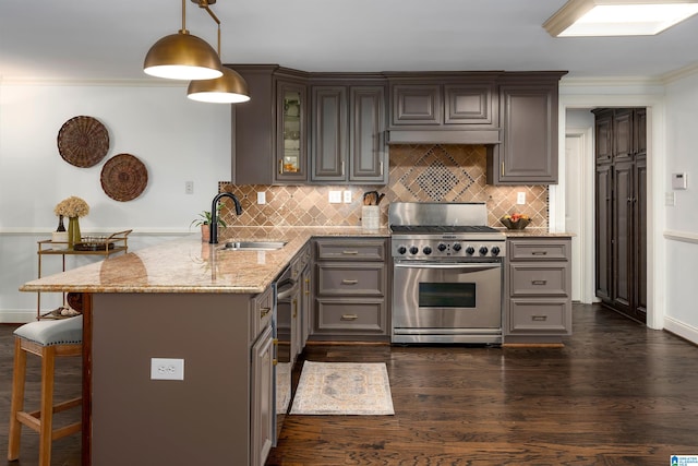 kitchen with dark hardwood / wood-style floors, kitchen peninsula, hanging light fixtures, a breakfast bar, and high end stainless steel range