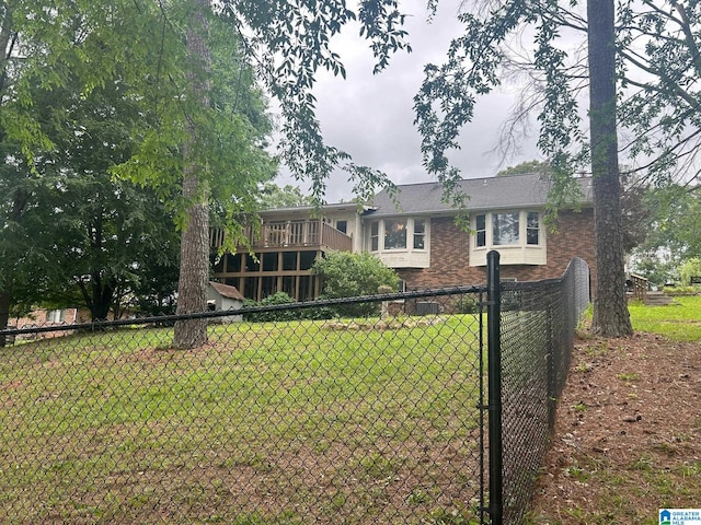 exterior space featuring a deck and a front yard