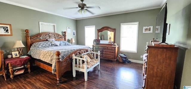 bedroom with ceiling fan, ornamental molding, and dark wood-type flooring