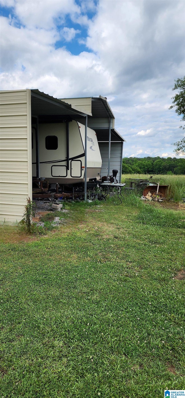 view of yard with a carport