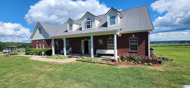 new england style home featuring a front yard