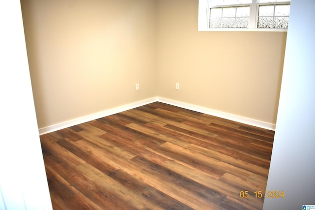 empty room featuring dark wood-type flooring