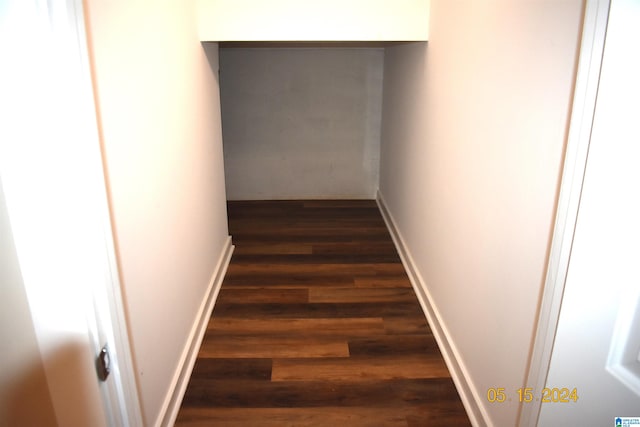 hall with dark wood-type flooring