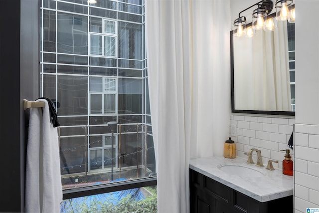 bathroom featuring backsplash and vanity