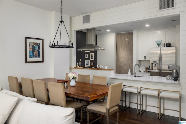 dining space with sink and dark hardwood / wood-style floors