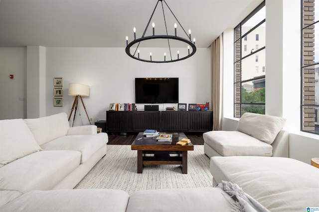 living room featuring a chandelier and hardwood / wood-style flooring