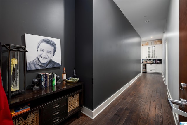 hall with dark hardwood / wood-style floors