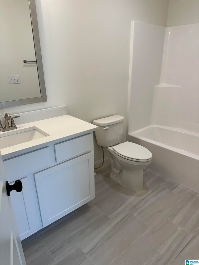 full bathroom with vanity, toilet, and shower / bathing tub combination