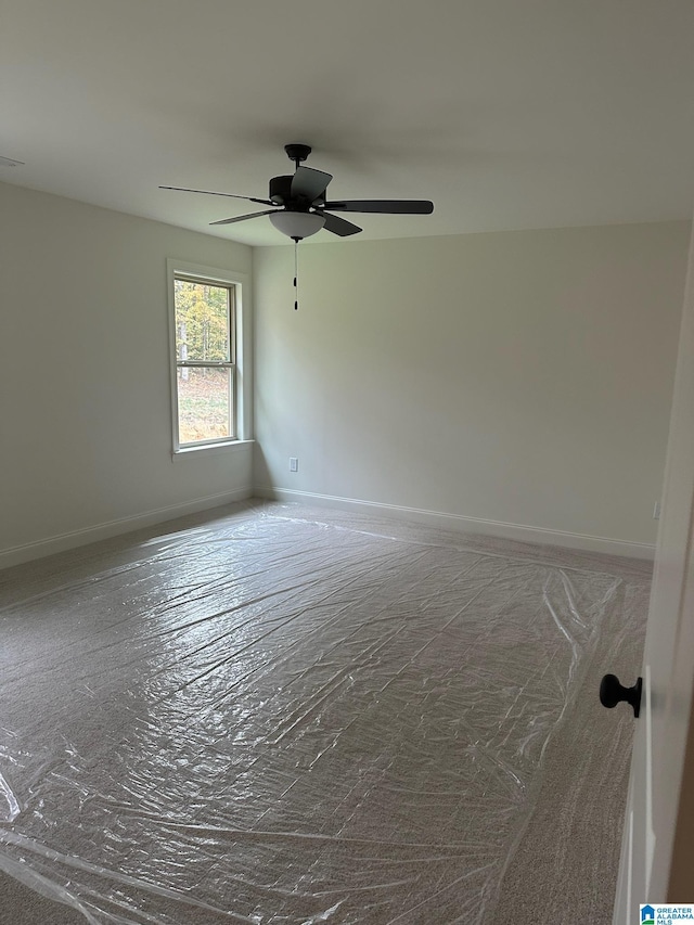 unfurnished room with ceiling fan