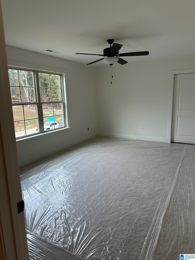 unfurnished room featuring ceiling fan