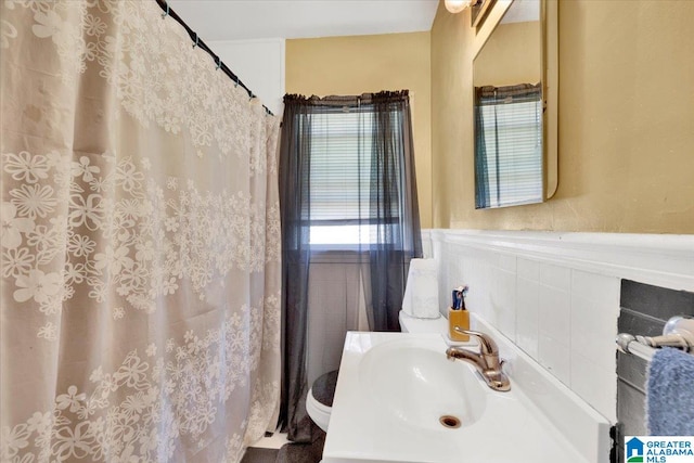 bathroom with sink and toilet