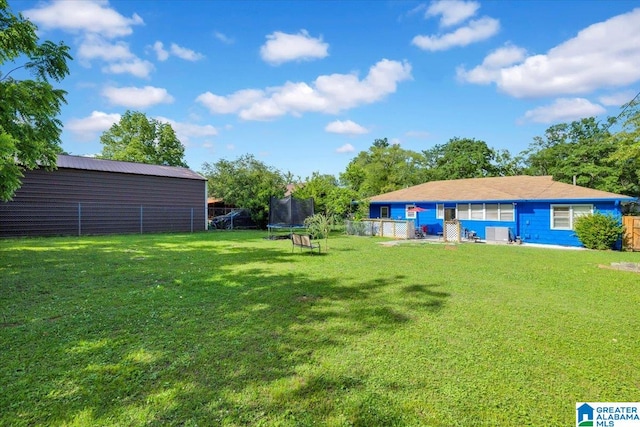 view of yard with a trampoline