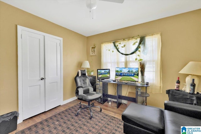 office space featuring wood-type flooring and ceiling fan