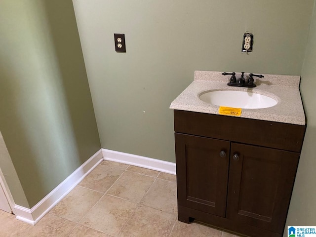 bathroom featuring tile flooring and vanity