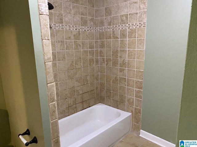 bathroom with tile flooring and tiled shower / bath combo