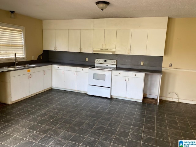 kitchen featuring white cabinetry, sink, white electric range oven, and dark tile floors