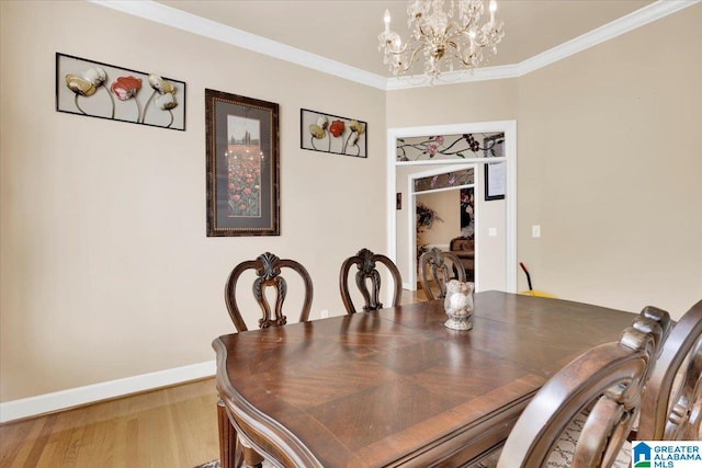 dining area featuring wood-type flooring, a chandelier, and ornamental molding