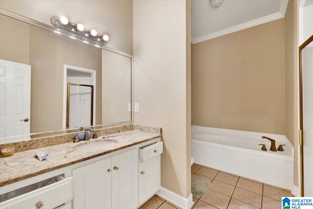 bathroom featuring vanity, ornamental molding, tile patterned floors, and a tub