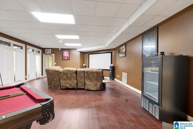 game room featuring wood-type flooring, billiards, and a paneled ceiling