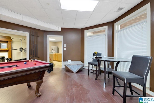 recreation room featuring a paneled ceiling, hardwood / wood-style flooring, and pool table