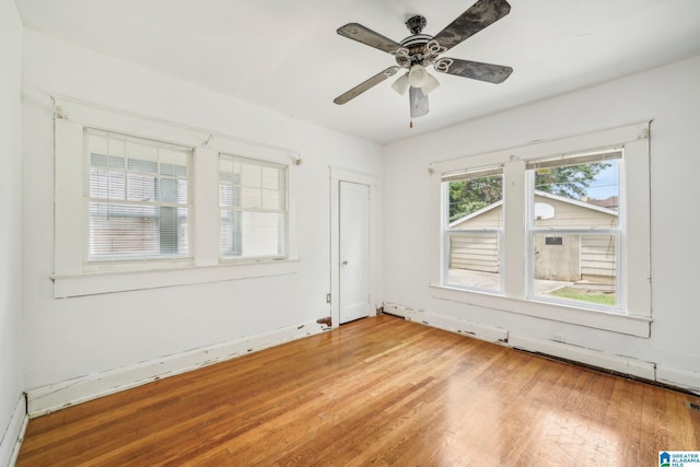 spare room featuring ceiling fan and wood-type flooring