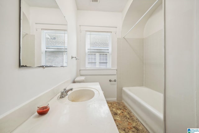 full bathroom with vanity, toilet, and shower / washtub combination