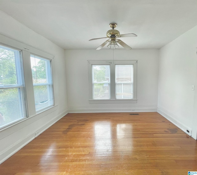 unfurnished room featuring light hardwood / wood-style floors and ceiling fan