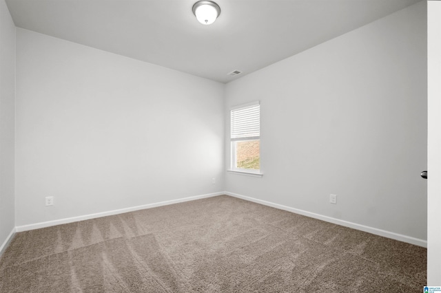 unfurnished room with carpet flooring