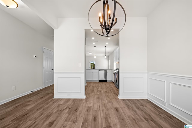 interior space with hardwood / wood-style floors and a notable chandelier