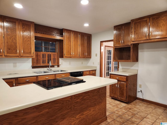 kitchen with sink, light tile flooring, and black dishwasher