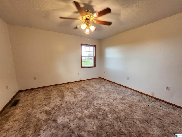 carpeted empty room with a textured ceiling and ceiling fan